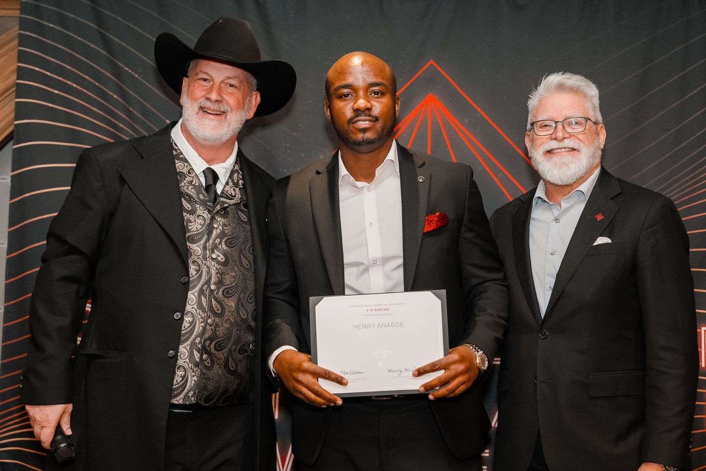 Henry receiving his 4 Diamond certificate on stage